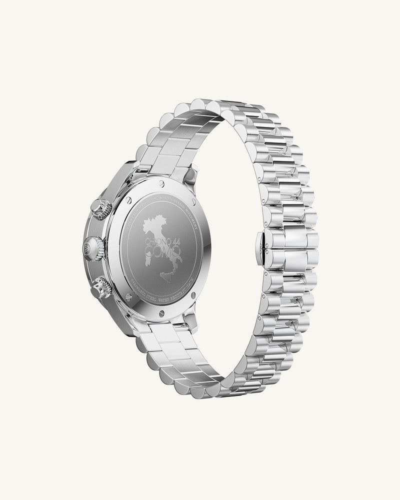 A round mens watch in rhodium-plated silver from Waldor & Co. with orange sunray dial and a second hand. Seiko movement. The model is Chrono 44 Como 44mm.