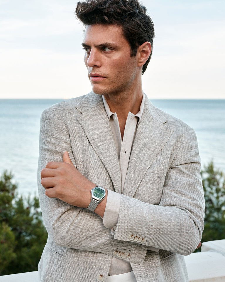 A tonneau mens watch in rhodium-plated silver from Waldor & Co. with green sunray dial and a second hand. Ronda movement. The model is Constant 40 Lecco.