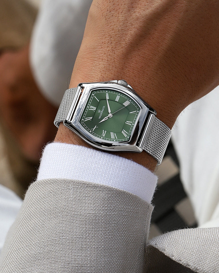 A tonneau mens watch in rhodium-plated silver from Waldor & Co. with green sunray dial and a second hand. Ronda movement. The model is Constant 40 Lecco.