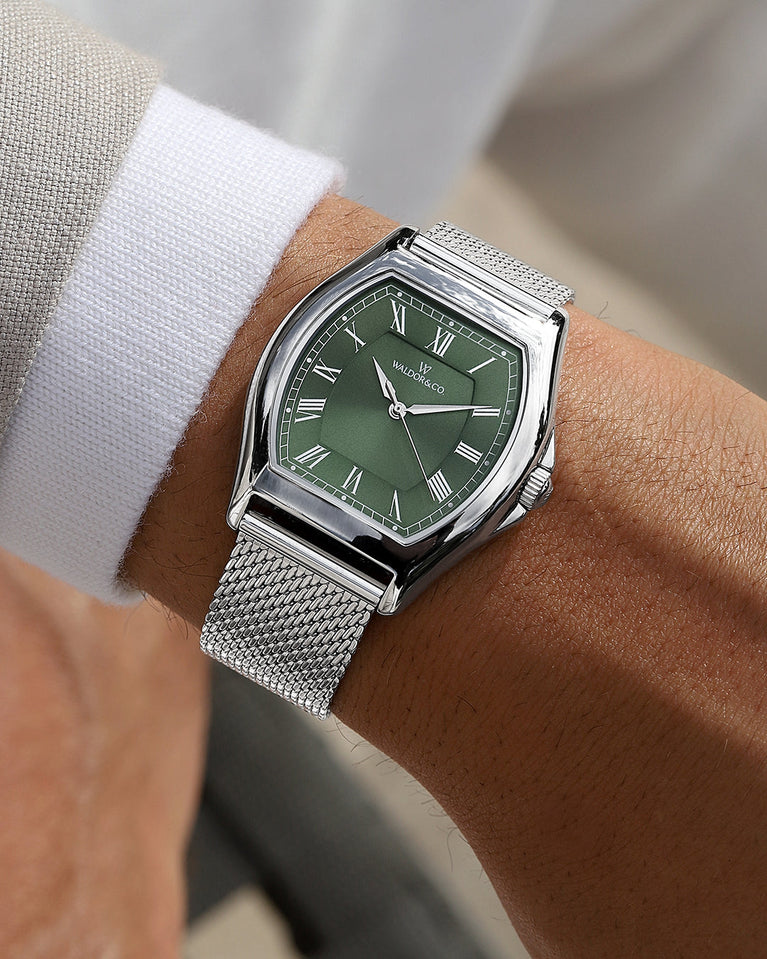 A tonneau mens watch in rhodium-plated silver from Waldor & Co. with green sunray dial and a second hand. Ronda movement. The model is Constant 40 Lecco.