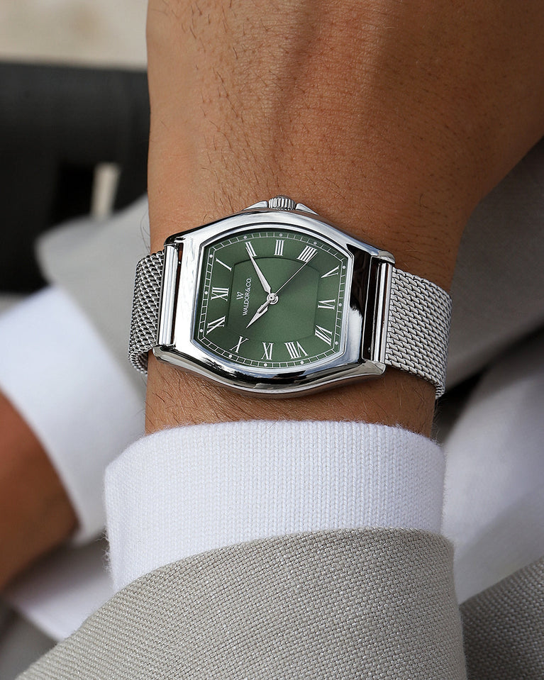 A tonneau mens watch in rhodium-plated silver from Waldor & Co. with green sunray dial and a second hand. Ronda movement. The model is Constant 40 Lecco.