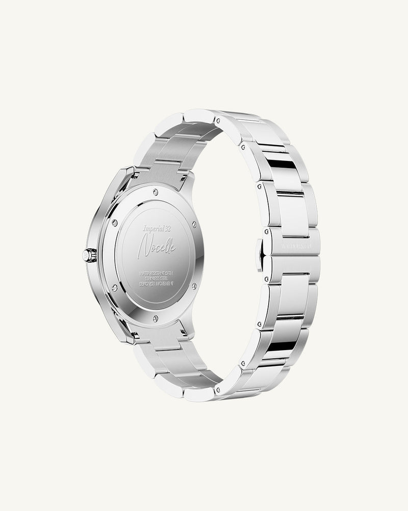 A round womens watch in silver from Waldor & Co. with turquoise sunray dial and a second hand. Seiko movement. The model is Imperial 32 Nocelle 32mm.