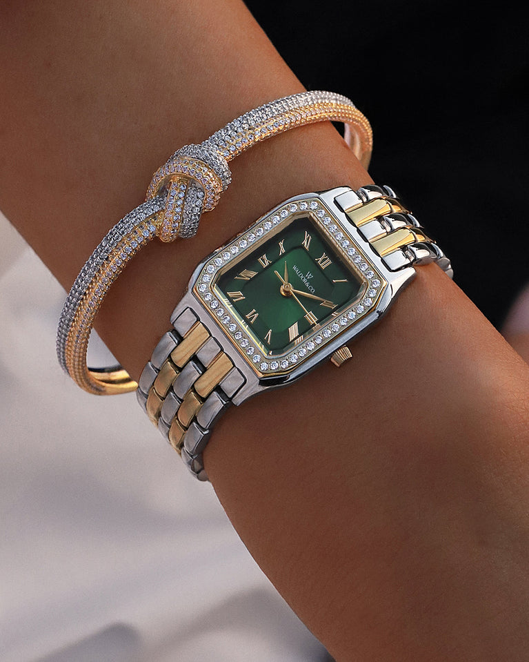  A square womens watch in Rhodium-plated 316L stainless steel from Waldor & Co. with emerald green dial. Bezel with premium crystals. Diamond Cut Sapphire Crystal glass dial. Seiko movement. The model is Eternal 22 Bellagio Pavè.