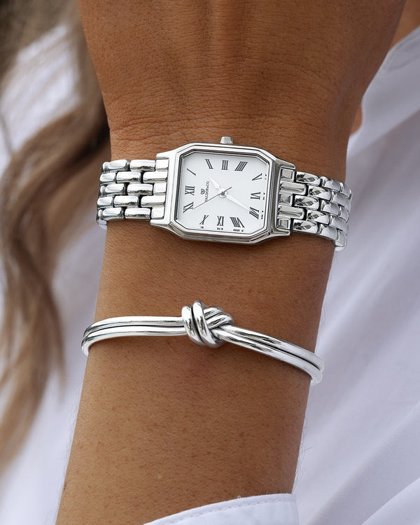  A square womens watch in Rhodium-plated 316L stainless steel from Waldor & Co. with white Diamond Cut Sapphire Crystal glass dial. Seiko movement. The model is Eternal 22 Bellagio.