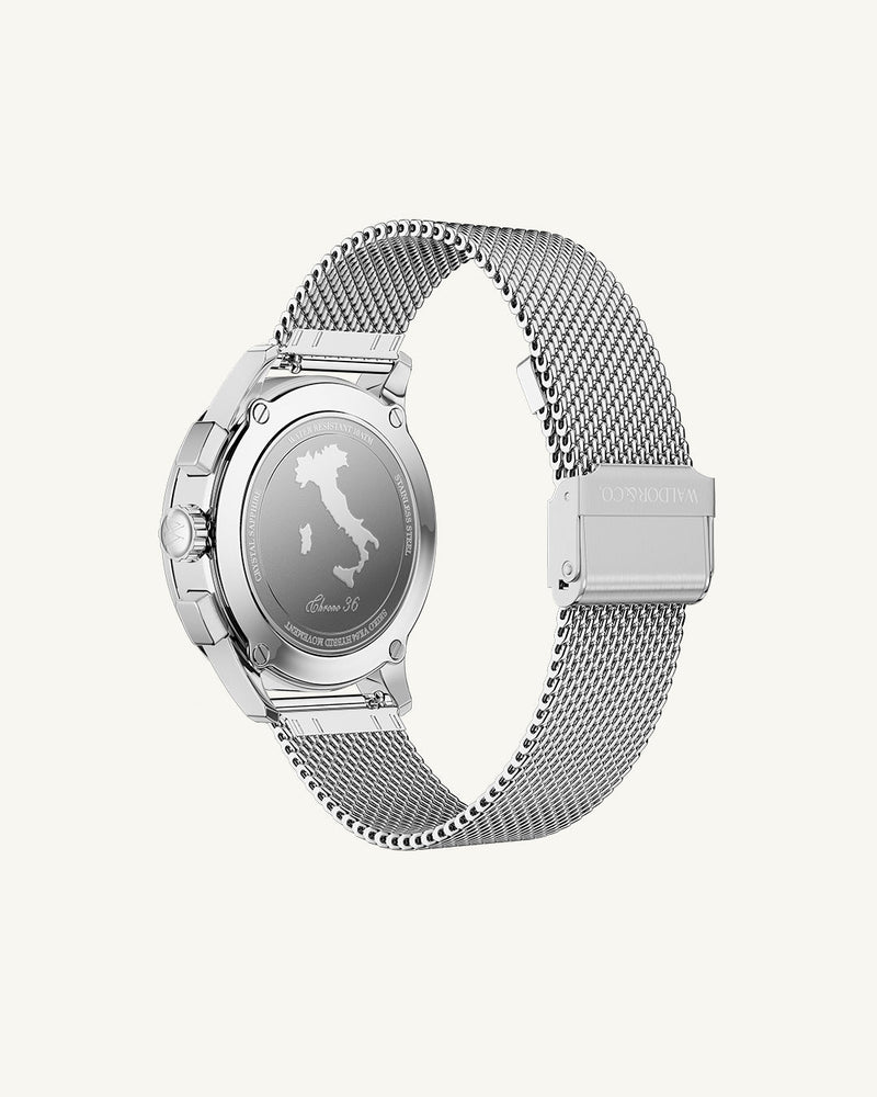 A round womens watch in rhodium-plated silver from Waldor & Co. with turquoise sunray dial and a second hand. Seiko movement. The model is Chrono 36 Sardinia 36mm.
