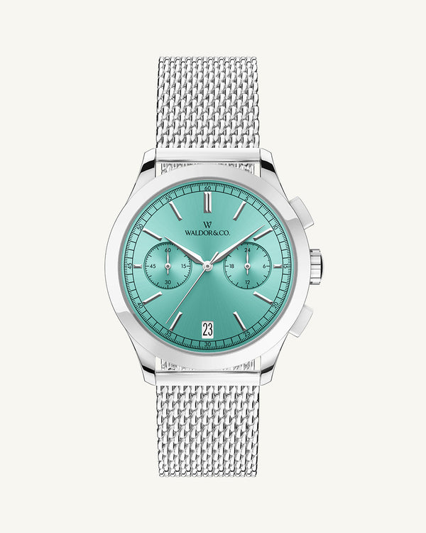 A round mens watch in rhodium-plated silver from Waldor & Co. with turquoise sunray dial and a second hand. Seiko movement. The model is Chrono 39 Sardinia 39mm.