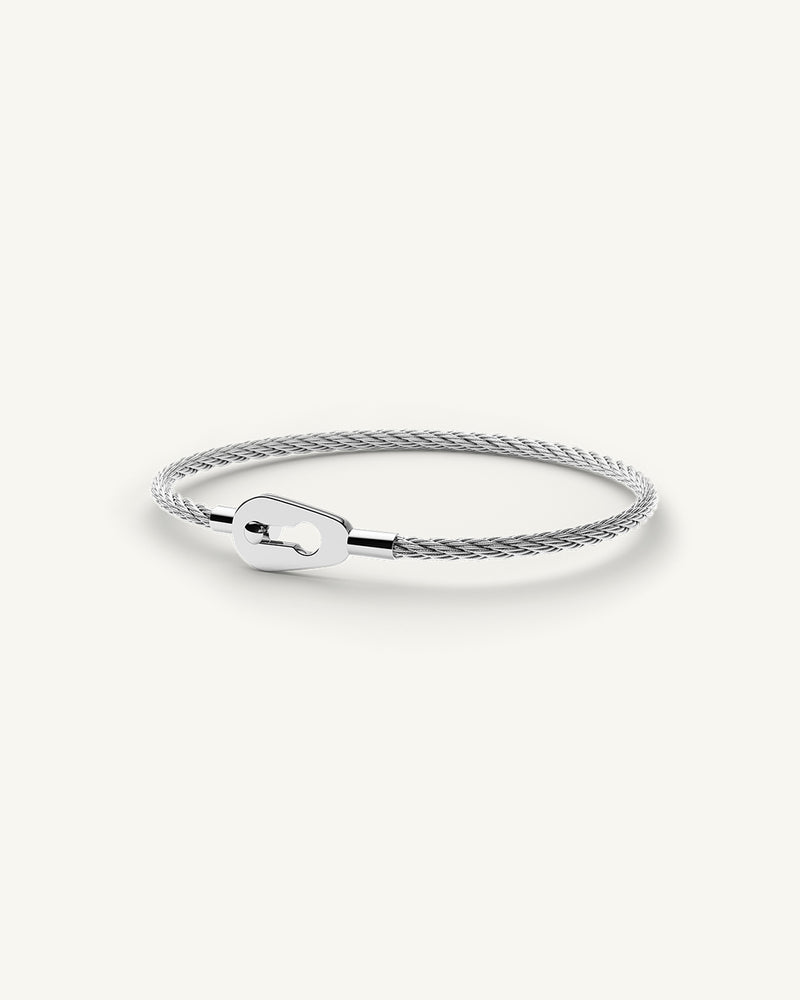 A Bangle in polished silver 316L stainless steel from Waldor & Co. One size. The model is Como Cable Polished.