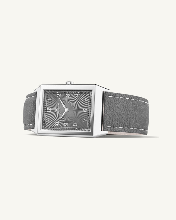 A square mens watch in Rhodium-plated 316L stainless steel from Waldor & Co. with grey guilloche dial. Miyota movement. Leather strap. The model is Conceptual 37 Cap Ferrat.