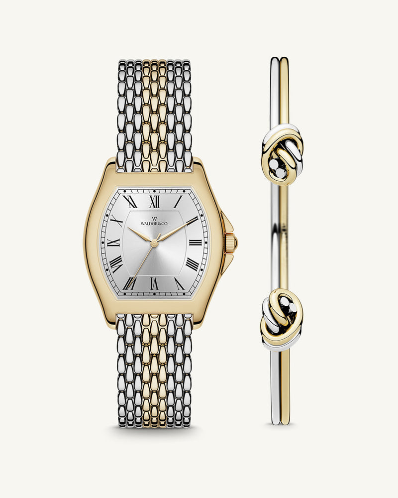 A square womens watch in 22k two-toned silver and gold plated 316L stainless steel from Waldor & Co. with domed mineral glass dial. Seiko movement. The model is Constant 36 Menaggio.