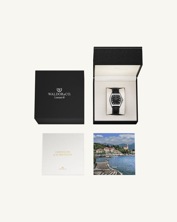 A square mens watch in Rhodium-plated 316L stainless steel from Waldor & Co. with white dial. Ronda movement. The model is Constant 40 Tremezzo 37x45mm.