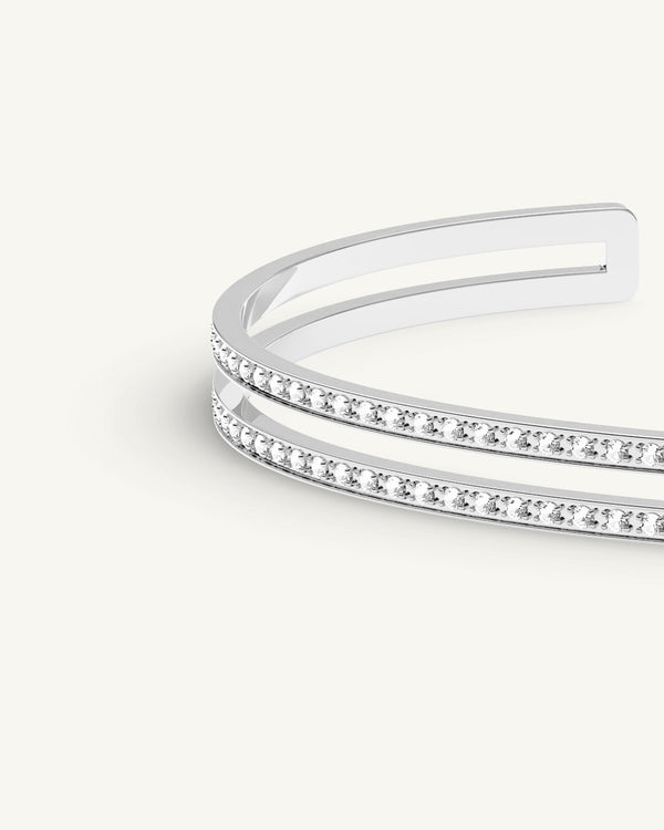 A Bangle in silver polished 316L stainless steel from Waldor & Co. One size. The model is Dual Diamond Bangle Polished.