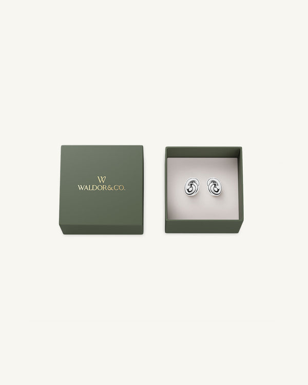 Earrings in silver plated-316L stainless steel from Waldor & Co. The model is Dual Knot Earring Polished.