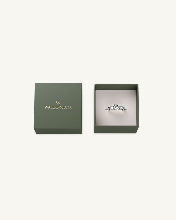 A Ring in Silver plated-316L stainless steel from Waldor & Co. The model is Dual Knot Ring Polished.