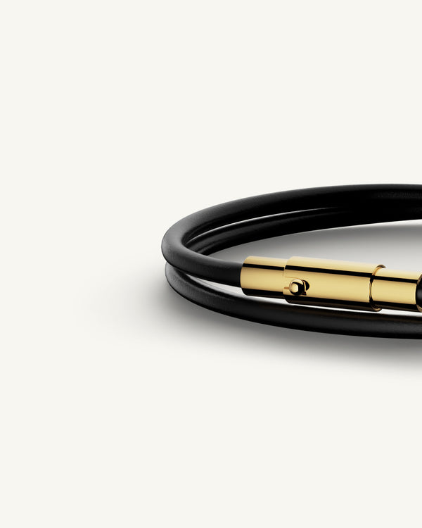 A Leather Bracelet in 14k gold-plated 316L stainless steel from Waldor & Co. The model is Dual Leather Bracelet Polished.