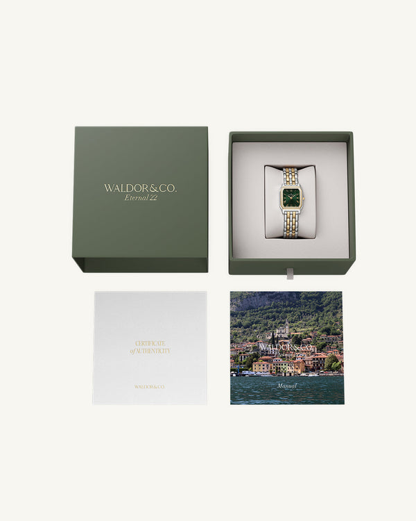 A square womens watch in Rhodium-plated 316L stainless steel from Waldor & Co. with emerald green dial. Bezel with premium crystals. Diamond Cut Sapphire Crystal glass dial. Seiko movement. The model is Eternal 22 Bellagio Pavè.