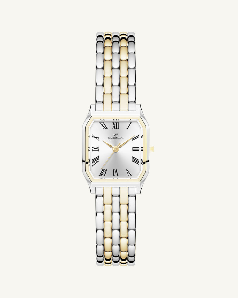 A square women’s watch and double knot bracelet in gold and silver from Waldor & co. The model is Eternal 22 Bellagio & Dual Knot Bangle.