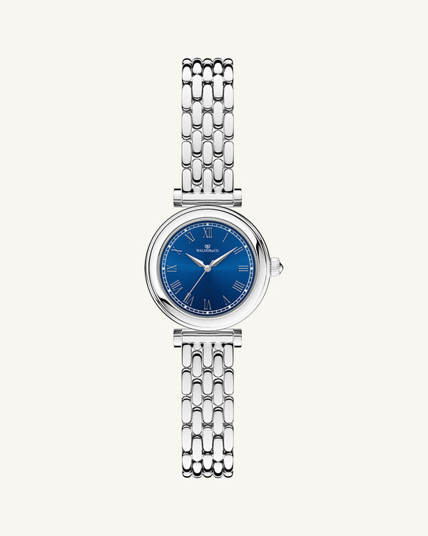 A round womens watch in Rhodium-plated 316L stainless steel from Waldor & Co. with blue Sapphire Crystal glass dial. Seiko movement. The model is Venia 24 Villefranche.
